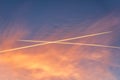 Airliner at high altitude with condesation trails. Royalty Free Stock Photo