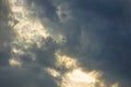 An airliner high in the sky flies into dramatic clouds