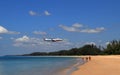Airliner or Passenger plane Boing 737 landing to airport next to the beach. airplane flies extremely low over the sea beach