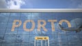 Airliner reflecting in the windows of airport terminal with PORTO text. 3d rendering