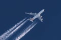 Airliner soaring through the sky with contrails airplane Royalty Free Stock Photo