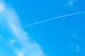 Airoplane on a cloudy blue sky Royalty Free Stock Photo
