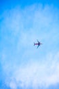 Airplan flies in a blue sky Royalty Free Stock Photo