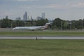 Airpland lands on runway at Charlotte Airport runway.