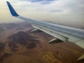 Airplane above the desert Sinay Royalty Free Stock Photo