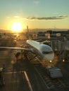 An airplane sits on a sunny runway