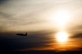 Airplane in the air at sunset background with space for text. S Royalty Free Stock Photo