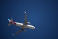 Airplane of the airline Eurowings from below against blue sky Royalty Free Stock Photo