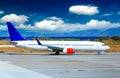 Airplane on airport runway under sunset view dramatic sky with evening light Royalty Free Stock Photo