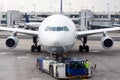 An airplane at airport on tarmac Royalty Free Stock Photo