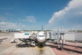 Airplane at airport terminal gate ready for takeoff. Modern international airport. Royalty Free Stock Photo