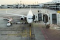 Airplane at airport terminal gate ready for takeoff. Modern international airport. Royalty Free Stock Photo