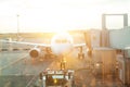 Airplane through airport window view at the terminal gate ready for takeoff Royalty Free Stock Photo