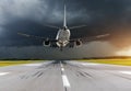 Airplane approach at the airport landing in bad weather storm hurricane rain.