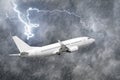 Airplane approach at the airport landing in bad weather storm hurricane rain llightning strike