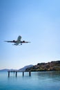 an airplane approaching Corfu town, close to the sea, Landing approach to Kerkyra Airport, Corfu Town Greece Royalty Free Stock Photo