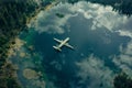 Airplane Approaching Lake Reflection Aerial View Royalty Free Stock Photo