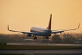 Airplane approaching for landing on airport runway Royalty Free Stock Photo