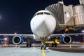 Airplane apron at the parking gangway at the airport at night. Royalty Free Stock Photo