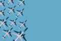 Airplane background. Flights, travel and aviation. Pattern of white planes on a blue background. The passenger plane is
