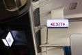 Airplane backlit exit sign Royalty Free Stock Photo