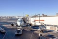 Airplane Being Serviced at Airport Gate Royalty Free Stock Photo