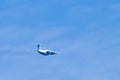 Airplane in blue sky. Air cargo transportation. Plane is flying Royalty Free Stock Photo