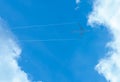 Airplane on blue sky and white clouds. Commercial airline flying on blue sky. Travel flight for vacation. Aviation transport Royalty Free Stock Photo