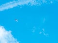 Airplane on blue sky and white clouds. Commercial airline flying on blue sky. Travel flight for vacation. Aviation transport. Royalty Free Stock Photo