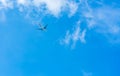 Airplane on blue sky and white clouds. Commercial airline flying on blue sky. Travel flight for vacation. Aviation transport Royalty Free Stock Photo