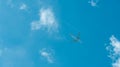 Airplane on blue sky and white clouds. Commercial airline flying on blue sky. Travel flight for vacation. Aviation transport Royalty Free Stock Photo