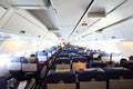 Airplane cabin with passengers Royalty Free Stock Photo