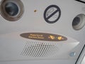 Signs in aircraft cabin for passengers. Royalty Free Stock Photo