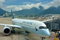 Airplane of Cathay pacific company is locating in Hongkong Airport