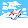 Cartoon plane flies on a background of white clouds and blue sky Royalty Free Stock Photo