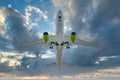 Airplane in the cloudy sky - Passenger Airliner - aircraft Royalty Free Stock Photo