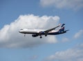 Airplane a321 in the cloudy sky Royalty Free Stock Photo