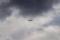 Airplane in the cloudy sky - Passenger Airliner aircraft, London, England Royalty Free Stock Photo