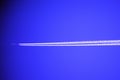 Airplane condensation trail Royalty Free Stock Photo
