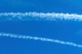 Airplane contrail across the blue sky