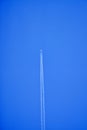 An airplane contrail in a clear blue sky. Royalty Free Stock Photo