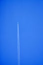 An airplane contrail in a clear blue sky. Royalty Free Stock Photo