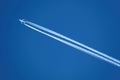 Airplane with contrail Royalty Free Stock Photo