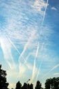 Airplane contrail or vapor trail pattern on blue sky