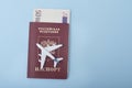 Airplane on the cover of a Russian passport. Euro. Travel concept. Blue background Royalty Free Stock Photo