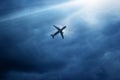 Airplane in dark blue sky and cloud in strom Royalty Free Stock Photo