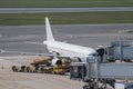 airplane docked airport loading unloading disembarkation boarding Royalty Free Stock Photo