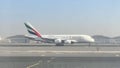 Airplane emirates at Dubai airport with flag of UAE