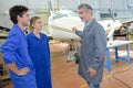 Airplane engineers inspection in hangar