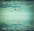 Airplane into evening sky with reflection Royalty Free Stock Photo